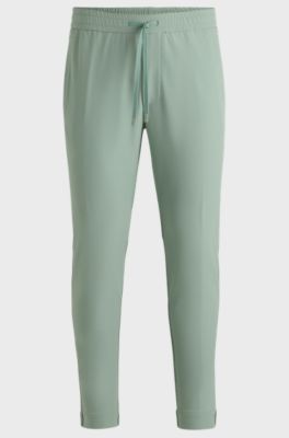 Pantalones tapered fit de tejido el&aacute;stico repelente al agua, Cal