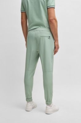 Pantalon Tapered en tissu stretch d&eacute;perlant, Chaux