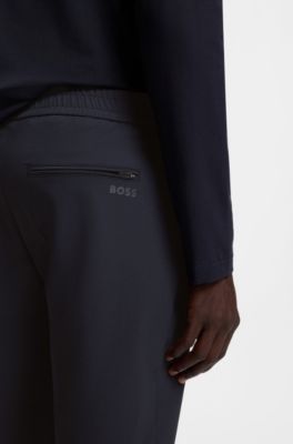 Pantaloni con fit affusolato in tessuto elasticizzato idrorepellente, Blu scuro