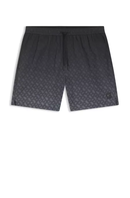 Bañador con insignia de logo y estampado de monogramas en degradado