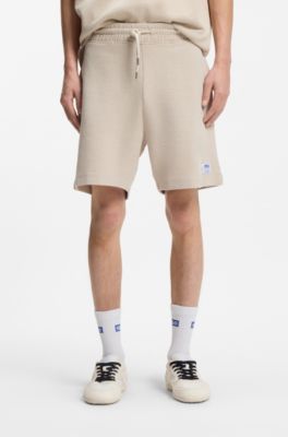 Loose fit-shorts i bomullsblandning med v&aring;ffelstruktur, Ljusbeige