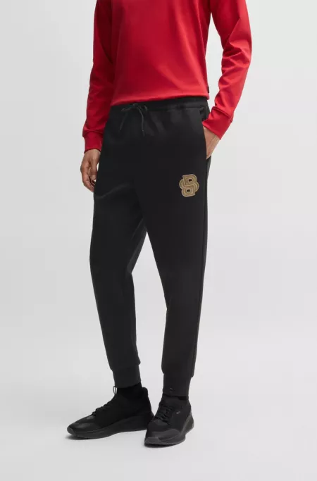 BOSS x Creation of the Gods tracksuit bottoms in cotton