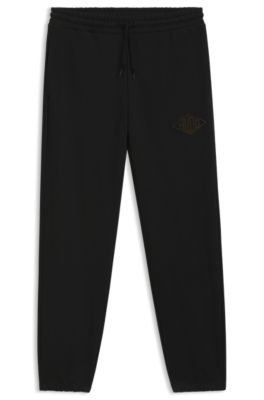 Cotton-terry tracksuit bottoms with embroidered logo, Black