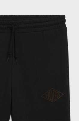 Cotton-terry tracksuit bottoms with embroidered logo, Black