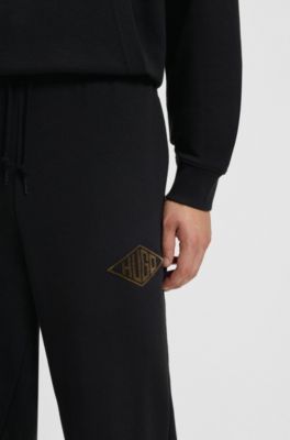 Cotton-terry tracksuit bottoms with embroidered logo, Black