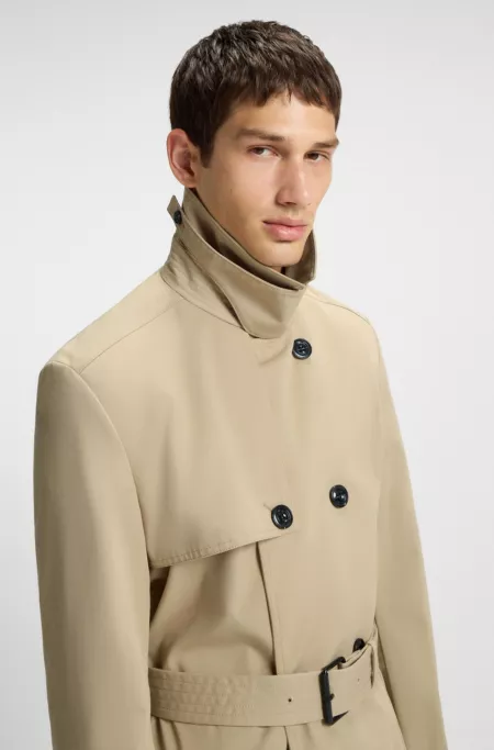 Water-repellent trench coat with buckled belt