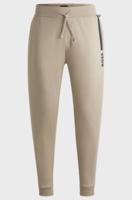 Drawcord tracksuit bottoms in cotton terry with logo print, Light Beige