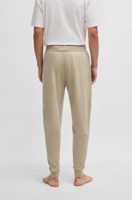 Drawcord tracksuit bottoms in cotton terry with logo print, Light Beige