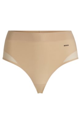 String à taille haute avec détails en mesh assurant un bon contrôle de la forme