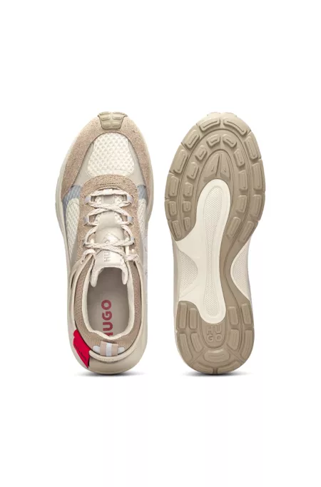 Mixed-material trainers with decorative reflective effects
