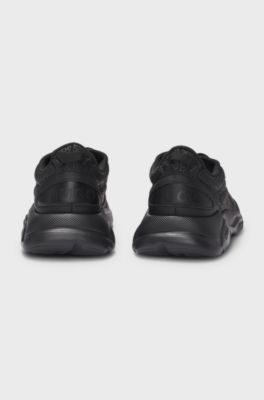 Mixed-material trainers with monogrammed uppers and EVA outsole, Black