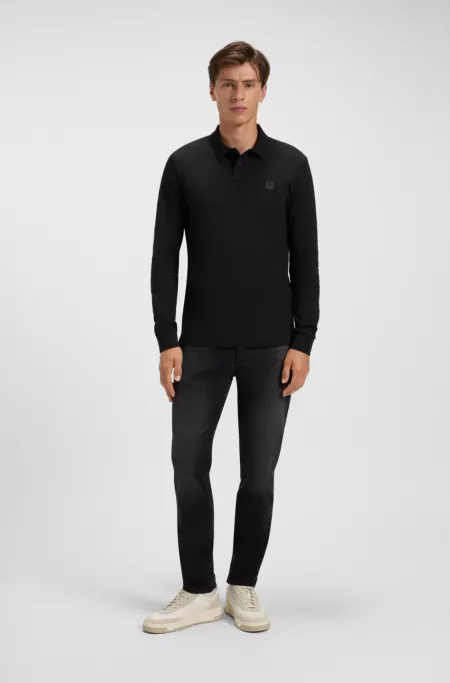 Tapered-fit jeans in black comfort-stretch denim