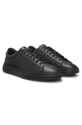 Leather trainers with embossed monograms, Black