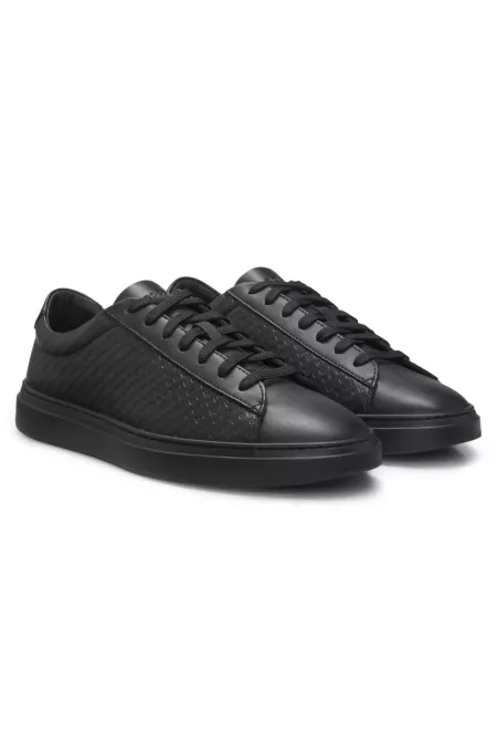 Leather trainers with embossed monograms
