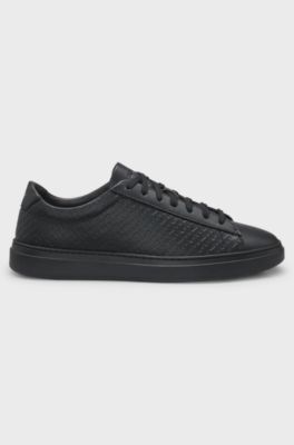 Leather trainers with embossed monograms, Black