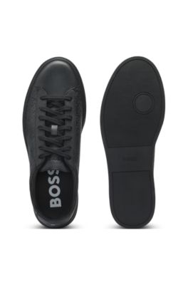 Leather trainers with embossed monograms, Black