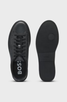 Leather trainers with embossed monograms, Black