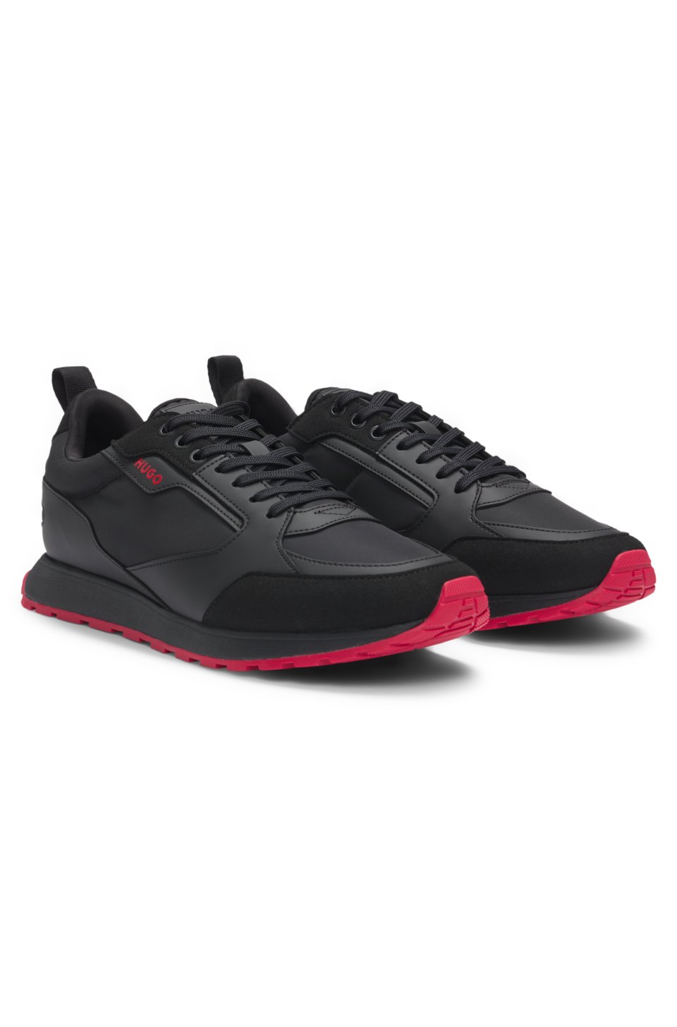 Mixed-material trainers with branded accents