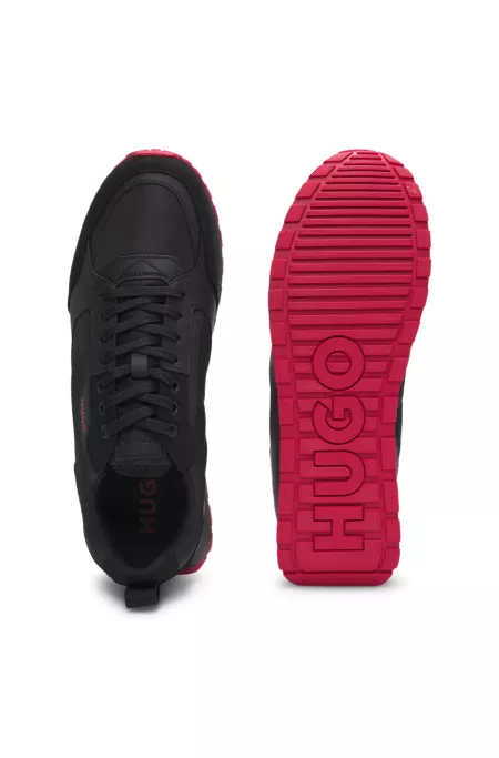 Mixed-material trainers with branded accents