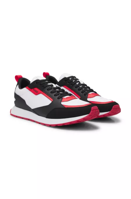 Mixed-material trainers with branded accents