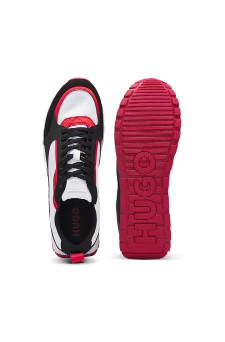 Mixed-material trainers with branded accents