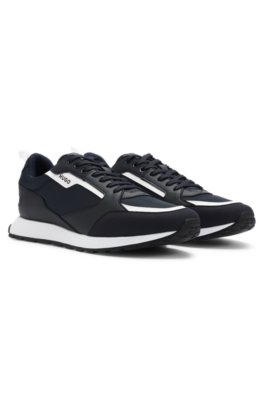 Mixed-material trainers with branded accents