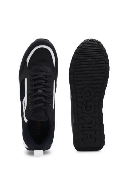 Mixed-material trainers with branded accents