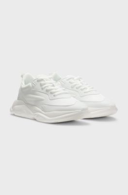 Mixed-material lace-up trainers with counter logo, White