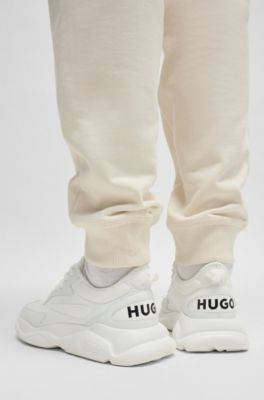 Mixed-material lace-up trainers with counter logo, White