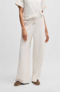 Wide-leg tracksuit bottoms in stretch fabric, White