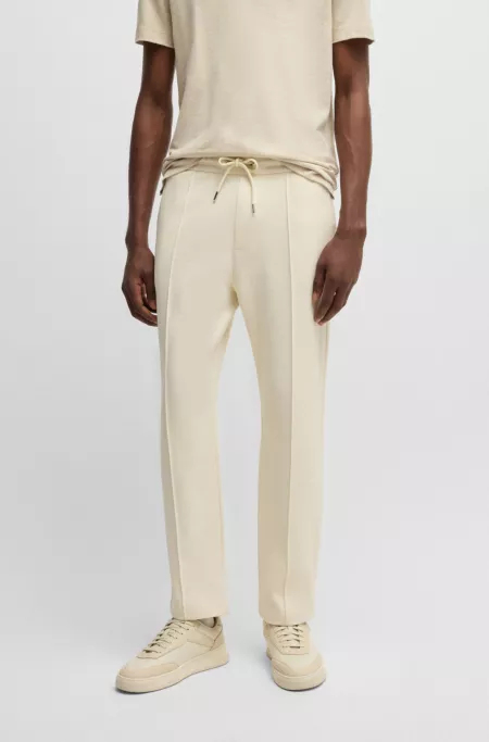 Modern-fit tracksuit bottoms in cotton-linen piqué