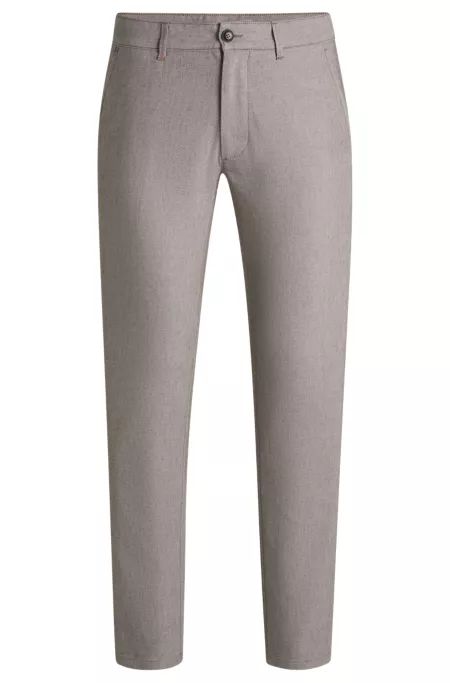 Pantalones slim fit en sarga elástica
