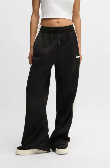 Retro-inspired tracksuit bottoms with side stripe