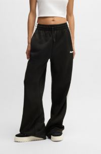 Trainingsbroek met retro-inspiratie en streep langs de zijlengte, Zwart