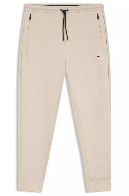 Stretch-cotton-blend tracksuit bottoms with logo patch