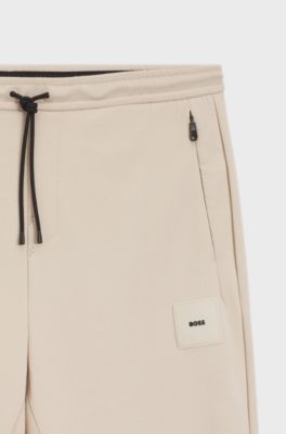 Stretch-cotton-blend tracksuit bottoms with logo patch, Light Beige