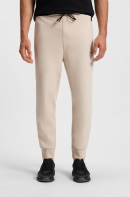 Stretch-cotton-blend tracksuit bottoms with logo patch, Light Beige