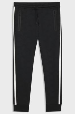 Relaxed-fit tracksuit bottoms with jacquard-woven circles, Black