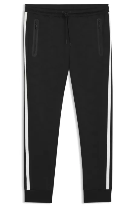 Relaxed-fit tracksuit bottoms with jacquard-woven circles