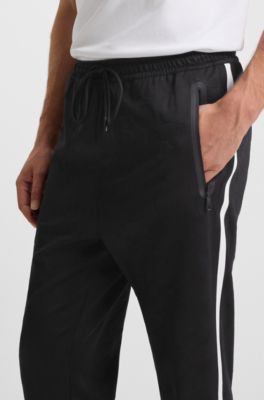 Relaxed-fit tracksuit bottoms with jacquard-woven circles, Black