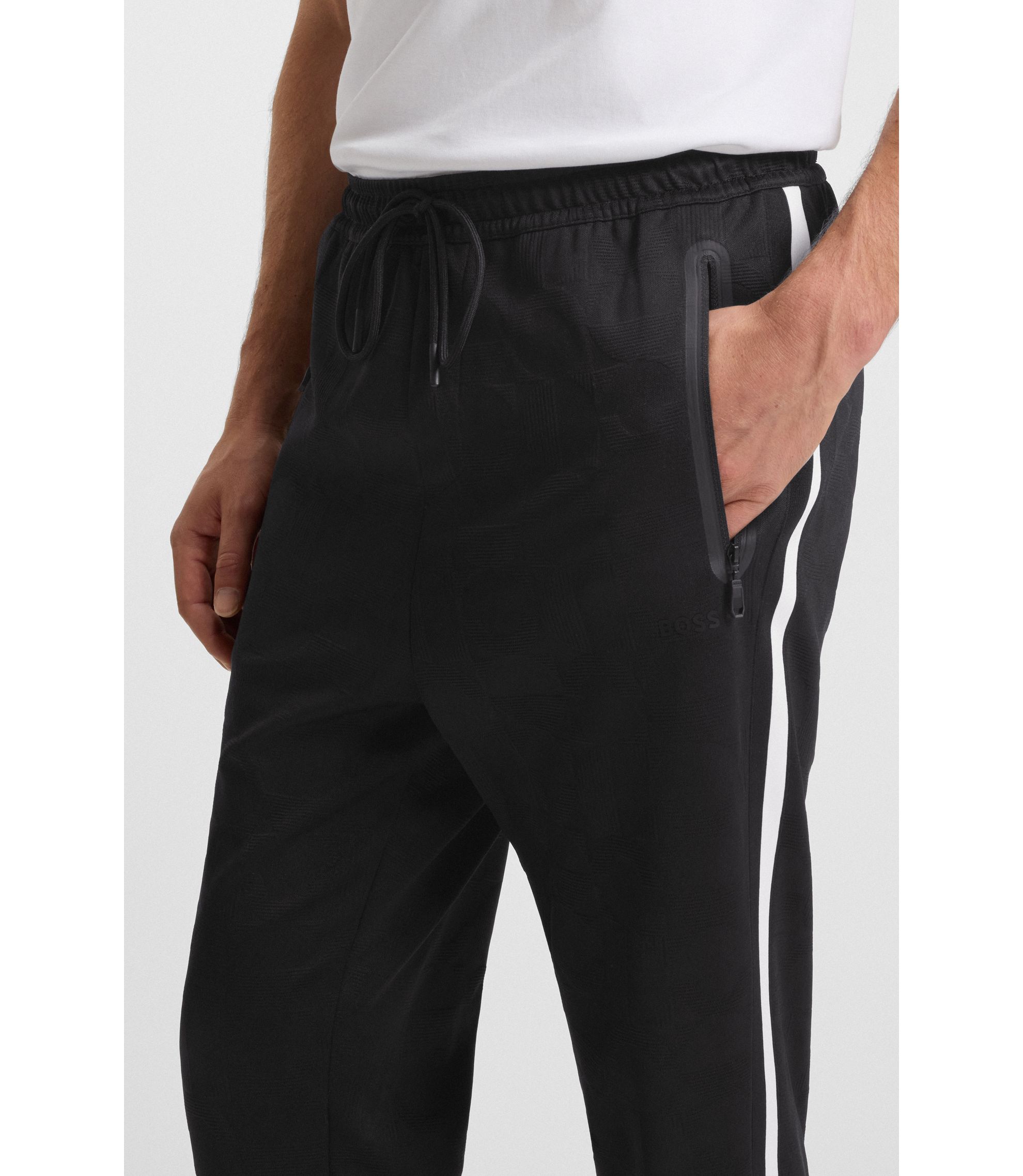 BOSS - Relaxed-fit tracksuit bottoms with jacquard-woven circles