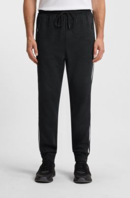 Relaxed-fit tracksuit bottoms with jacquard-woven circles, Black