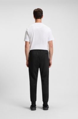 Relaxed-fit tracksuit bottoms with jacquard-woven circles, Black