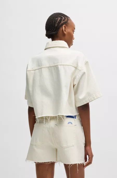 Cropped ecru-denim blouse with raw hem