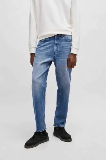 Relaxed tapered-fit jeans in blue vintage-wash denim