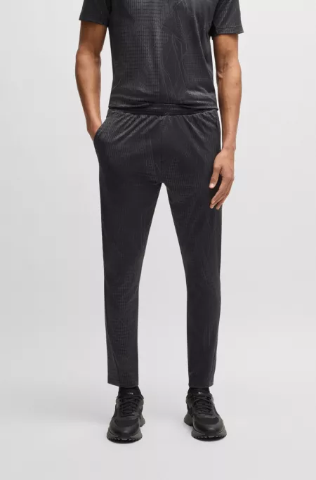 Active patterned tracksuit bottoms in four-way stretch fabric