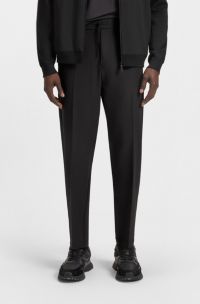 Water-repellent tapered-fit trousers in easy-iron stretch fabric, Black