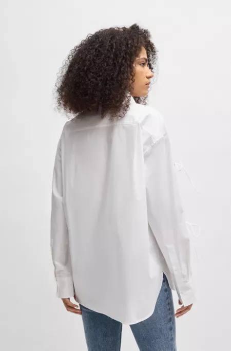 Oversized-fit cotton blouse with sleeve bows