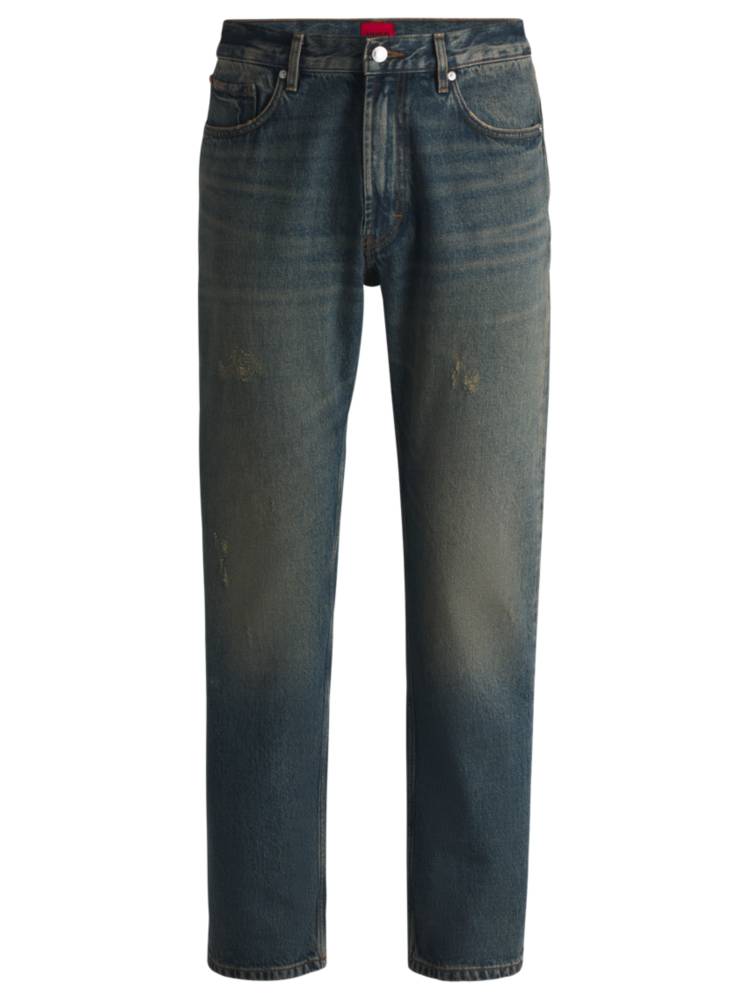 Artikel klicken und genauer betrachten! - Die HUGO Jeans aus blauem Baumwoll-Denim mit kreativer Färbung und Used-Effekten präsentiert sich in legerer Passform. Der Bund hat eine mittlere Höhe. | im Online Shop kaufen