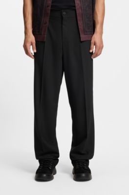 Pantalones de corte moderno en sarga el&aacute;stica con raya delantera, Negro